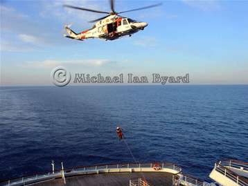 Helicopter crewman being lowered